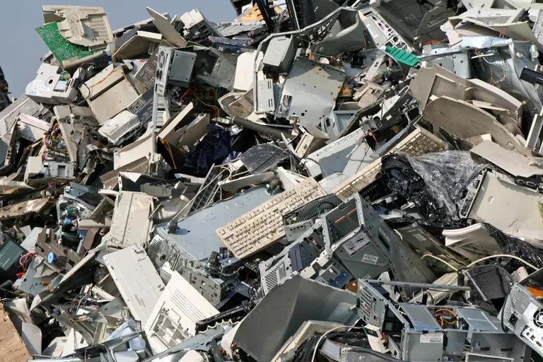Pile of discarded computers, keyboards and electronic scrap